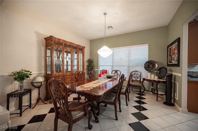 dining room with a notable chandelier