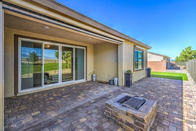 view of patio with an outdoor fire pit