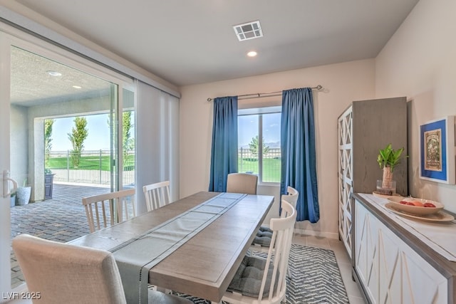 dining room featuring light tile patterned floors