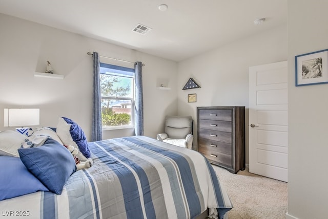 bedroom featuring light carpet