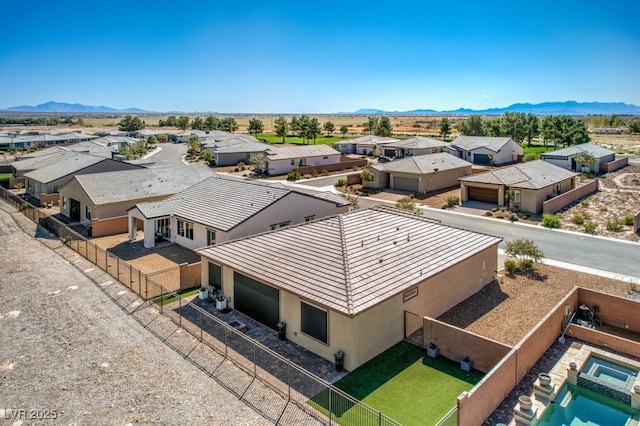 birds eye view of property featuring a mountain view