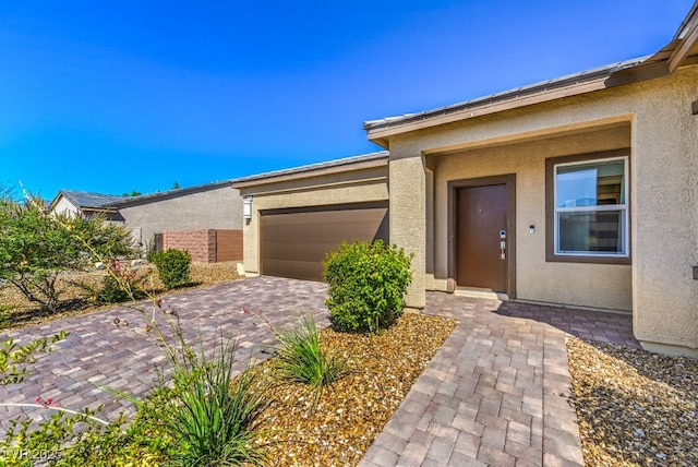 view of front of home with a garage