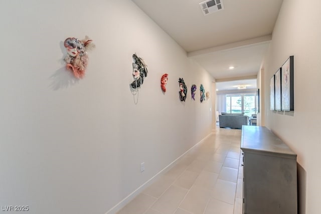 hall featuring light tile patterned flooring