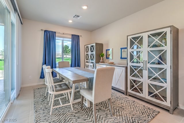 dining room with light tile patterned flooring