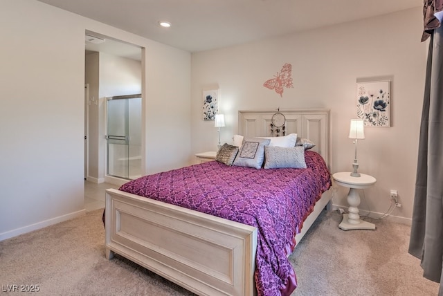 bedroom featuring connected bathroom and light carpet