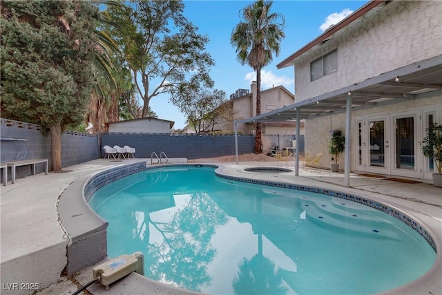 view of pool with a patio area and french doors