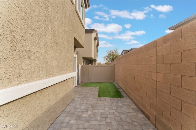 view of side of home featuring a patio