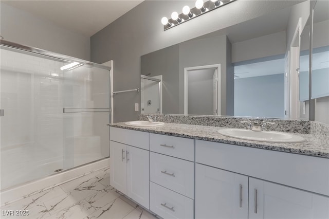 bathroom with vanity and an enclosed shower