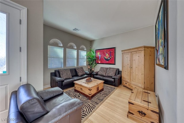 living room with light hardwood / wood-style flooring