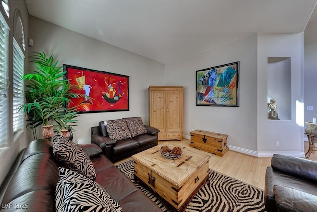 living room with hardwood / wood-style flooring and plenty of natural light