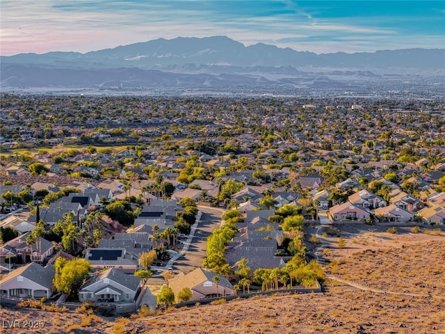 birds eye view of property with a mountain view