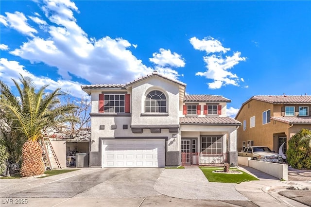 mediterranean / spanish home featuring a garage