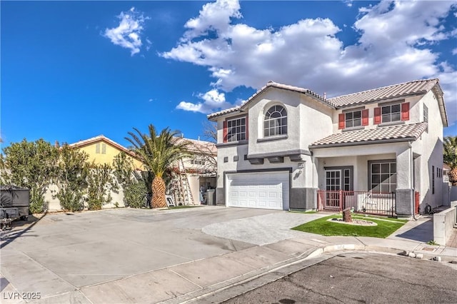 mediterranean / spanish-style home with a garage