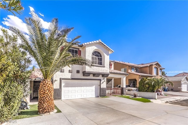 mediterranean / spanish home featuring a garage