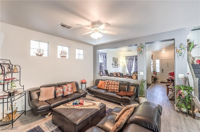 living room featuring hardwood / wood-style flooring and ceiling fan