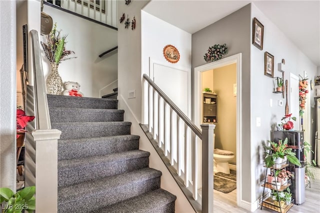 stairway featuring hardwood / wood-style floors