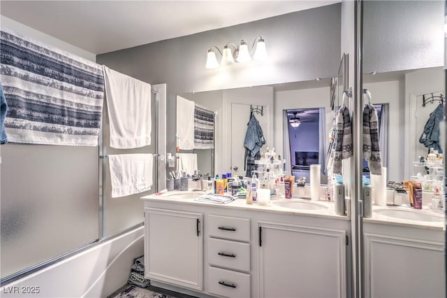 bathroom with enclosed tub / shower combo and vanity