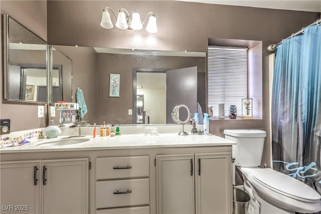 bathroom with vanity, toilet, and a shower with shower curtain