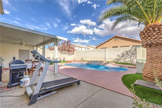 view of pool featuring grilling area, pool water feature, a patio, and ceiling fan