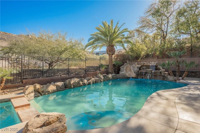 view of swimming pool featuring a fenced backyard, a fenced in pool, and a water slide