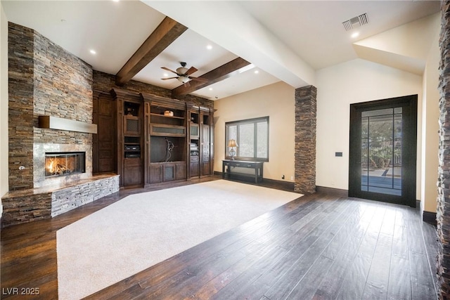 unfurnished living room featuring visible vents, a ceiling fan, hardwood / wood-style floors, a fireplace, and baseboards