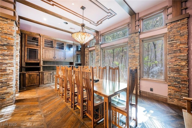 unfurnished dining area with baseboards