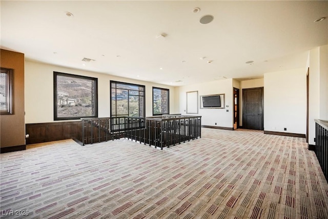 living area featuring visible vents and baseboards