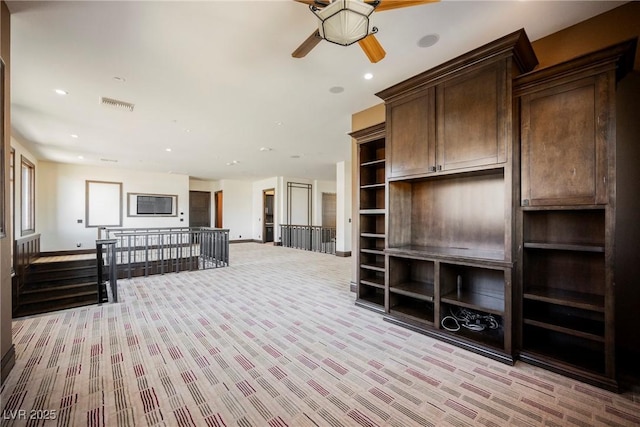 living room featuring a ceiling fan, baseboards, visible vents, recessed lighting, and light carpet