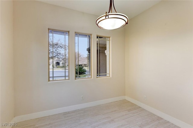 empty room with light hardwood / wood-style floors