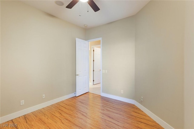 empty room with ceiling fan and light wood-type flooring