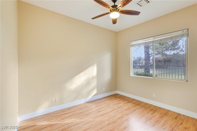 empty room featuring ceiling fan and light hardwood / wood-style flooring