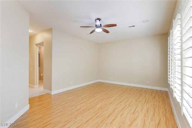 spare room with light hardwood / wood-style floors and ceiling fan