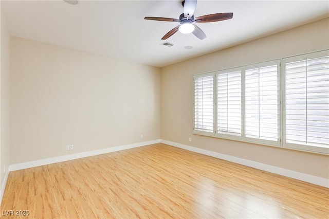 unfurnished room with ceiling fan and light hardwood / wood-style flooring