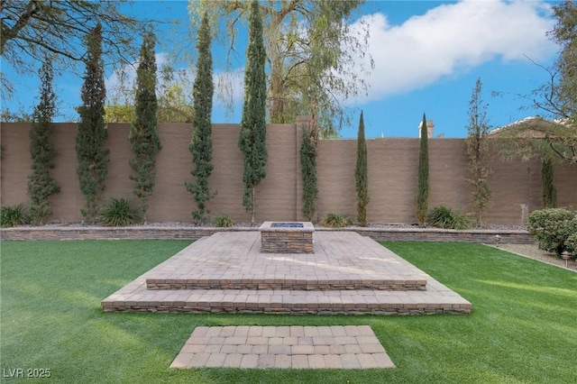 view of yard with an outdoor fire pit