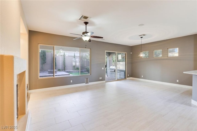 unfurnished room with light hardwood / wood-style flooring and ceiling fan