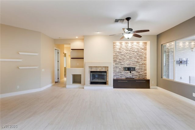 unfurnished living room featuring ceiling fan and light hardwood / wood-style floors