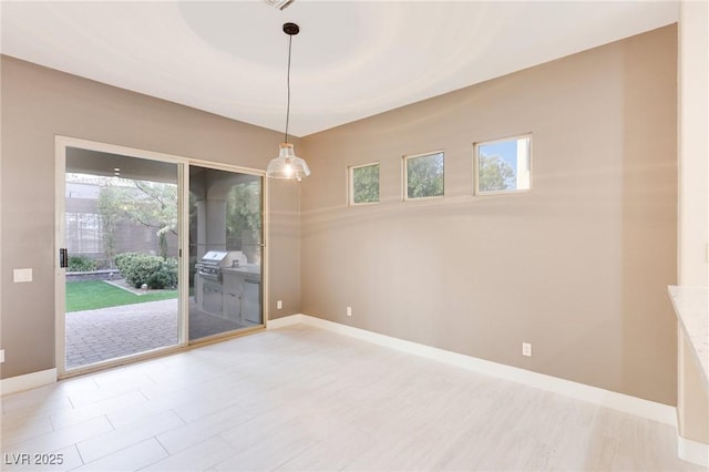 spare room with plenty of natural light