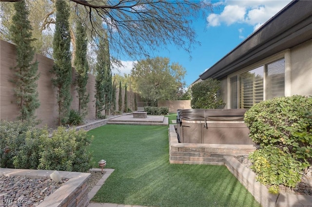 view of yard with a hot tub and a patio