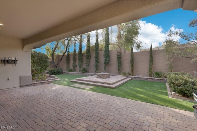 view of patio / terrace featuring a fire pit