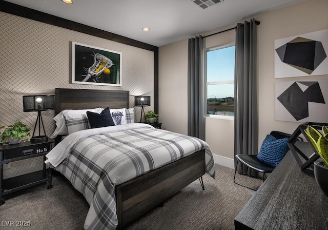 bedroom with a water view and carpet