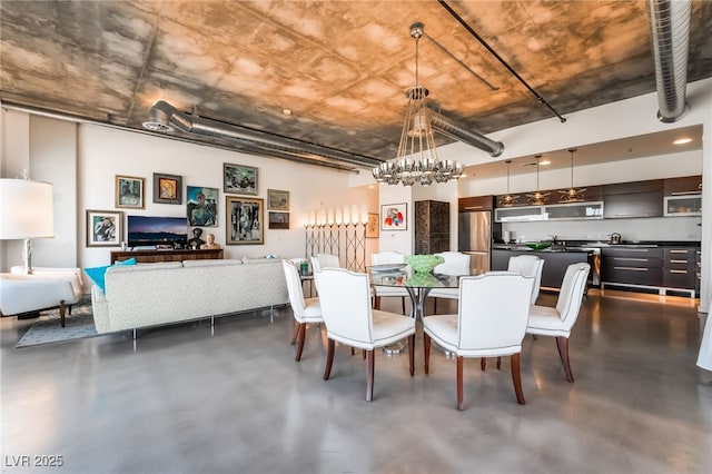 dining space featuring an inviting chandelier