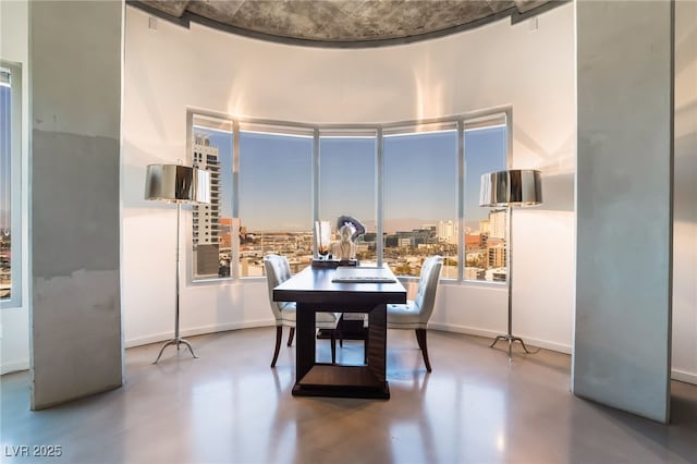 dining space with concrete flooring