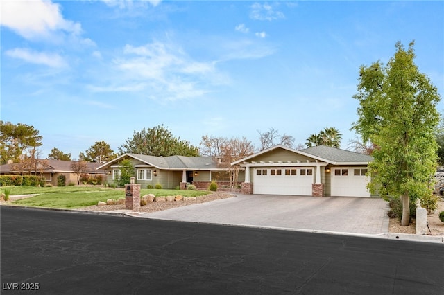 ranch-style home with a garage and a front yard