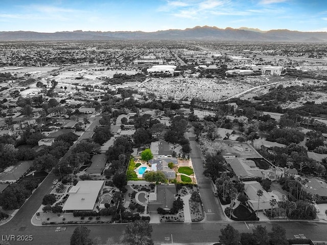 birds eye view of property with a mountain view