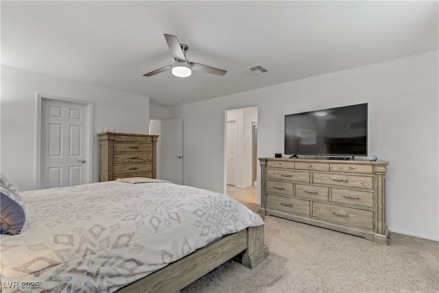 bedroom featuring light carpet and ceiling fan