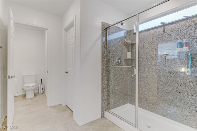 bathroom with toilet, a shower with shower door, and tile patterned flooring