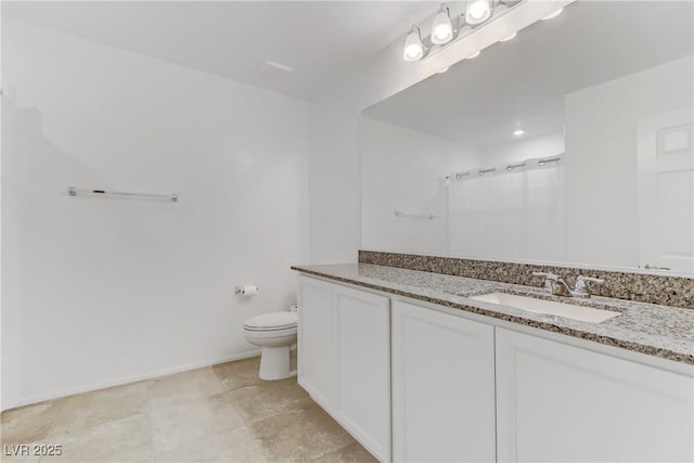 bathroom with vanity, a shower with shower curtain, and toilet