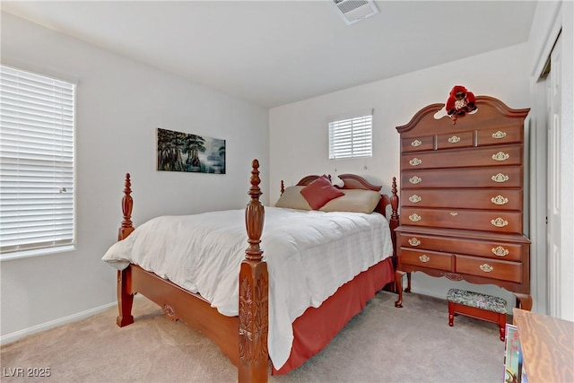 bedroom featuring light colored carpet