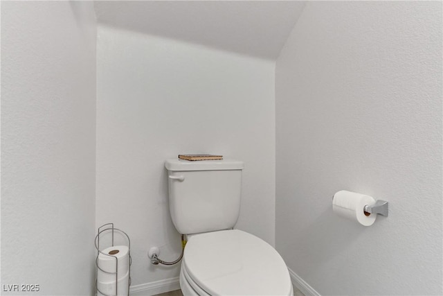 bathroom featuring toilet