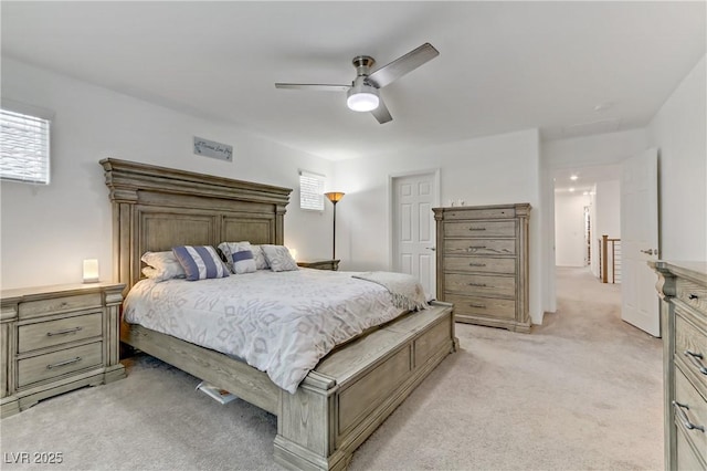 bedroom with light colored carpet and ceiling fan